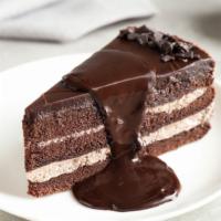 Chocolate Cake · Deep, dark, rich two-layer cake, drenched in chocolate syrup and covered with soft, chocolat...