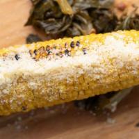 Porch Corn · Boiled corn on the cob, finished off on the grill, then we add butter, salt, pepper, & parme...