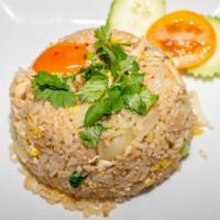 Basil Fried Rice · Eggs, green onions, basil, jalapeño, red bell pepper, yellow onions, and tomatoes.
