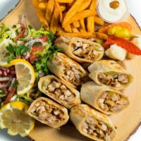 Chicken Shawarma · 100% Halal marinated chicken with garlic sauce and cucumber pickles. Served with a side of f...