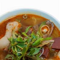 Bún Bò Hu · Spicy beef and wide noodle soup with pork hock.