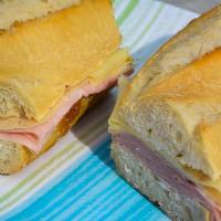 Ham &  Swiss  · European-style butter, cooked ham and imported Swiss cheese on a warm baguette. Served with ...