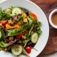 Garden Salad · Mixed greens, tomato, cucumber, carrot, house-made croutons and balsamic vinaigrette.