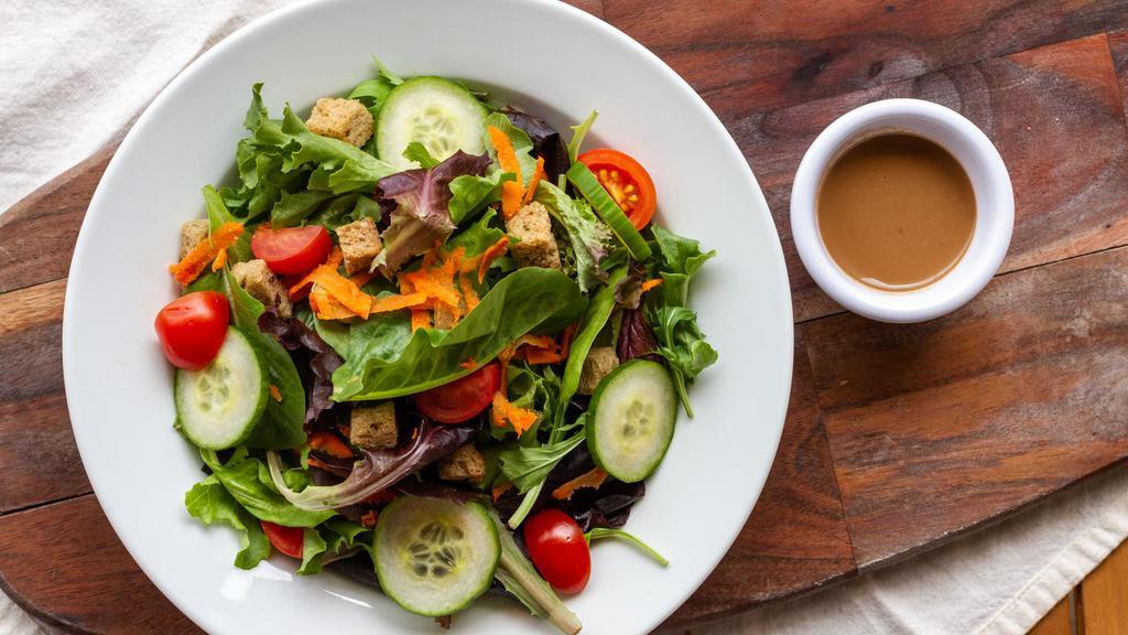 Garden Salad · Mixed greens, tomato, cucumber, carrot, house-made croutons and balsamic vinaigrette.