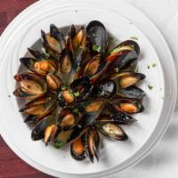 Mussels Caprese · Mussels with white wine, parsley, lemon, garlic and olive oil.