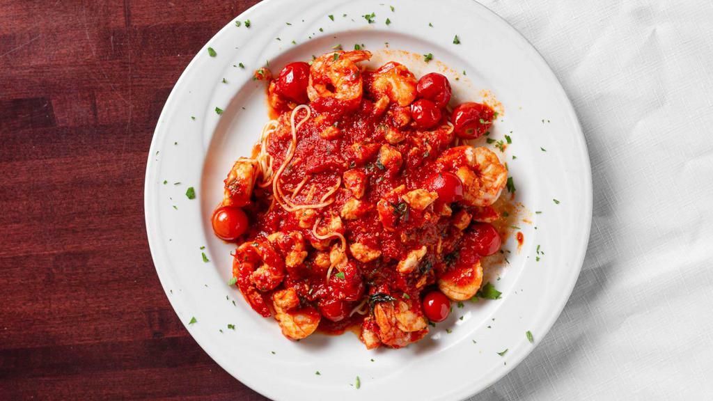 Capellini Adriatica · Shrimp, scallops and crab meat in fresh cherry tomato sauce over angel hair pasta.