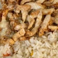 Arroz Con Pollo · Grilled strips of chicken over a bed of Spanish rice, covered with melted cheese. Served wit...