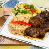 Jerk Chicken · It comes with rice, peas, and vegetables.
