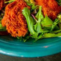 Dragon Wings · Lightly, breaded chicken wings served with house made Jamaican jerk and caesar chipotle dres...