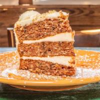 Carrot Cake · Subtly spiced and generously covered with cream cheese, made with grated carrots, sweet crus...
