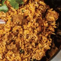 Lamb Biryani (Gf) · Basmati Rice stir fried with lamb, garlic, ginger, onion, and whole spices. Served with yogu...
