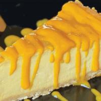 Mango Cheesecake (Gf) · Light & moist cheesecake, bursting with flavor from the king of fruits