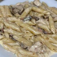Chicken Carbonara · Strips of chicken breast, sauteed mushrooms, shallots, and bacon. All tossed with alfredo sa...