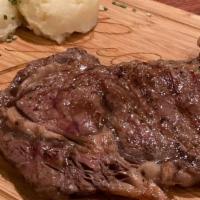 12Oz Rib Eye Steak · 12 ounces of juicy rib-eye steak served with a side of mild Italian sausage and caesar salad...