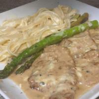 Veal Gorgonzola · Veal cutlets topped with asparagus and gorgonzola cheese in a brown creamy sauce.