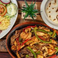 Mixed Fajitas · Chicken, steak, shrimps, mixed with peppers, onions, served with rice beans, salad