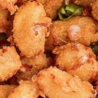 Wisconsin Fried Cheese Curds · Harp® beer-battered Wisconsin White Cheddar Cheese curds fried crisp and served with our but...