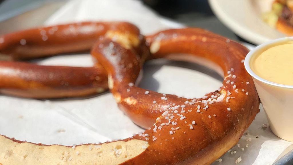 Soft Pretzel · A warm soft jumbo pretzel lightly salted and baked served with Mo’s Zesty 4-cheese sauce & honey mustard.