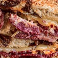 Mo'S Reuben · Mo's very own slow-cooked corned beef piled high with sauerkraut, thousand island dressing a...