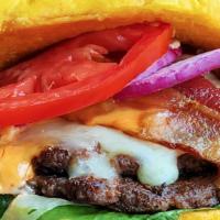 The Mo'S Burger · Like no other in town! Two heaping hand pressed Angus beef patties layered with corned beef,...
