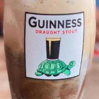 Guinness Float · Vanilla ice cream, Guinness, and chocolate syrup topped with whipped cream and cinnamon