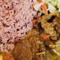 Curry Goat · Chunky pieces of goat slowly simmered in an aromatic blend of garlic, ginger, thyme, onions ...