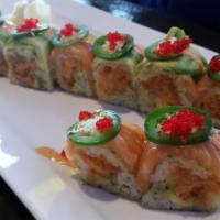 Kiss Of Fire · Spicy tuna, avocado, wrapped in kunbu seaweed topped with salmon, white tuna,jalapeño, tobik...