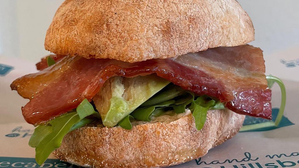 Bam Sandwich · Crispy bacon, avocado slices, house roasted garlic mayonnaise, arugula.