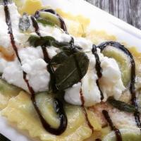 Ravioli Spinach Ricotta · Spinach Ricotta Ravioli, with butter and sage, topped with extra ricotta and balsamic vinega...