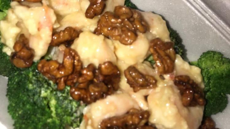 Walnut Glazed Shrimp · Large jumbo shrimp, lightly pan-flashed and tossed with a delicious cream glaze, topped with walnuts surrounded by a bed of broccoli.