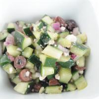 Kronos · Diced cucumbers, kalamata olives, red onions, peppers, feta cheese, and housemade Greek dres...