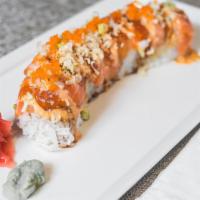 Pink Dragon · Salmon, avocado, spicy mayo eel sauce, wrapped around a California roll.