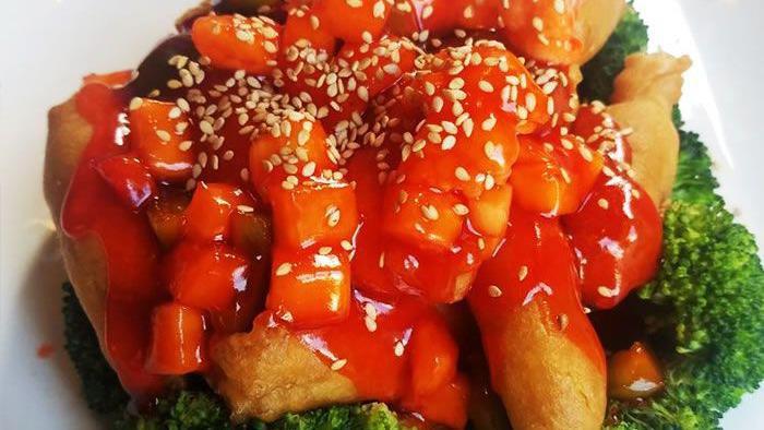 Sesame Tofu · Hot and spicy. Vegan. Deep fried firm tofu with general tso's sauce over steamed mixed vegetables.