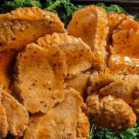 Black Pepper Seitan · Vegan. Thin-sliced wheat protein sauteed in a savory black pepper brown sauce over kale.