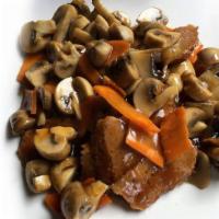 Mushroom Seitan · Vegan. Thin sliced wheat protein sauteed in savory brown sauce with mushrooms.