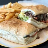 Steak & Cheese Sub · Steak & Cheese made on a 9 inch sub with provolone cheese, fried onion, lettuce, tomato, and...