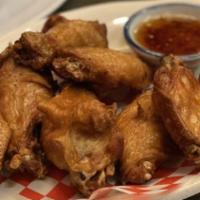 Fried Chicken Wings · Deep fried crispy chicken wings served with sweet chili sauce.