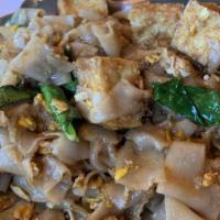 Pad See Ew · Wide flat rice noodle stir-fried with your choice of meat, Chinese broccoli and egg with swe...