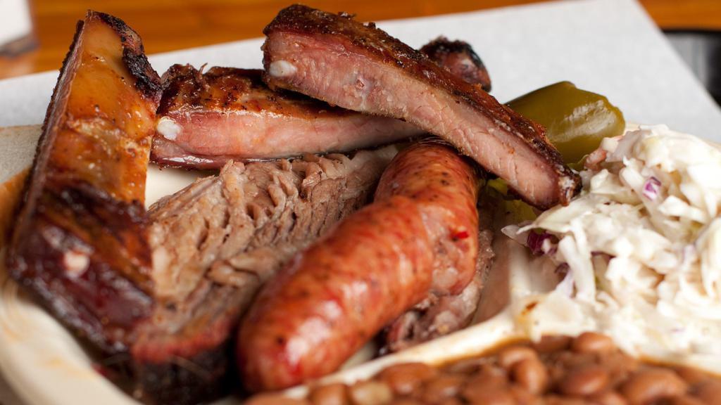 3 Meat Plate · Choose from our Slow Smoked Selection of Sliced Brisket, Chopped Beef, Pork Ribs, Sausage, or Turkey