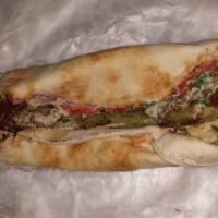 Falafel Sandwich · Vegetarian. Deep fried vegetable patties made of chick peas, fava beans, garlic, cumin, and ...