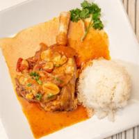 Lamb Shank Entrees · Roasted seasoned lamb shank topped with a fresh tomato sauce. Served with rice and Lebanese ...