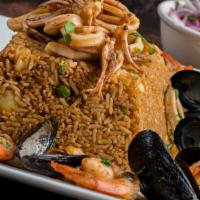 Arroz Con Mariscos · Peruvian seafood paella, yellow rice, fish broth, mussels, calamari, scallops, shrimp, simme...