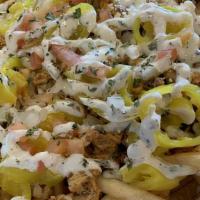 Shawerma Fries · Fries topped with Banana Pepper - Mo’s Sauce - Diced Onion & Tomato