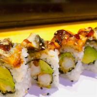 Black Dragon Roll · Shrimp tempura & avocado inside, topped with eel and  eel sauce.
(8 pieces per order.)