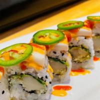 Latin Heat Roll · Spicy white tuna, crunchy flakes, cilantro inside, topped with seared white fish, jalapeno, ...