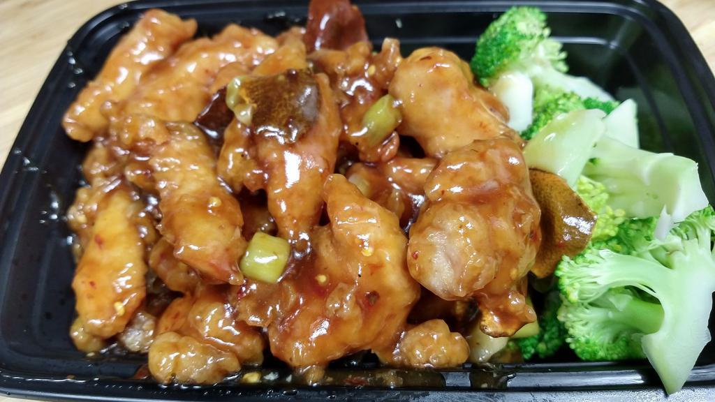 Orange Chicken · Fried battered chicken sauteed in tangy spicy sauce, garnished with steamed broccoli