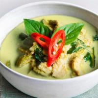 Green Curry · Spicy green curry in coconut milk with broccoli, zucchini and bamboo shoot, garnished with r...