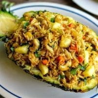 Thai Pineapple Fried Rice · Pineapple, shrimp,peas,carrot,cilantro,onion, and scallions.