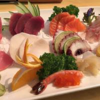 Sashimi Deluxe · 28 pieces of assorted fresh sliced raw fish.