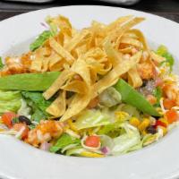 Azteca Salad · Choice of grilled chicken, steak or carnitas lightly tossed with lime dressing, black bean c...